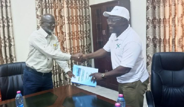 Technical Director of E&P, Mr. Abudu handing over documents of the equipment to Prof Amankwaa