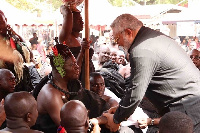 Former President Jerry John Rawlings in a handshake with Otumfuo