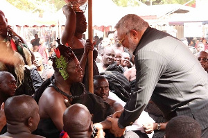 Former President Jerry John Rawlings in a handshake with Otumfuo