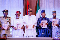 Nigerian President, Muhammadu Buhari with some of his officials [photo credit: Bayo Omoboriowo]