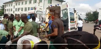 Some of the students being carried away in an ambulance