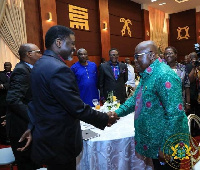 Bishop Charles Agyinasare in a handshake with Akufo-Addo