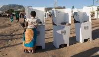 Women in a voting booth