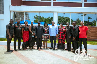 Mahama and family members of the late musician in a group photo