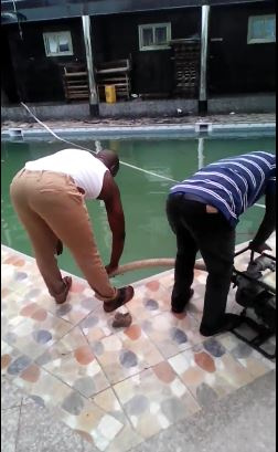 Some Fire officers using the water from the pool