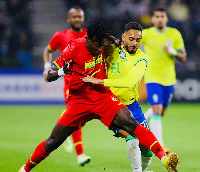 Mohammed Salisu tackles a Brazilian player