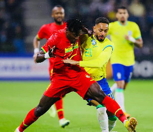 Mohammed Salisu tackles a Brazilian player