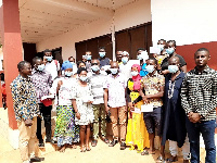 Mr Oppong (middle) with the beneficiaries and Dormaa West NDC executives