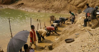 Miners working near the Birim River