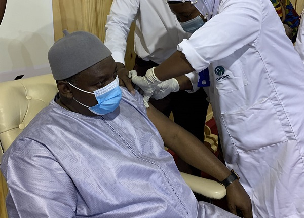 Gambia president Adama Barrow receives his shot