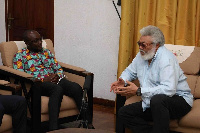 Former President, JJ Rawlings with Registrar of the Scholarship Secretariat, Kingsley Agyemang