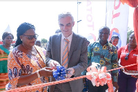 The District Chief Executive (L) and Managing Director of Total (L) commissioning the facility