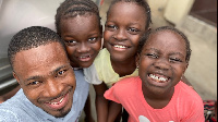 Kofi Adoma Nwanwani with the twins and thier cousin