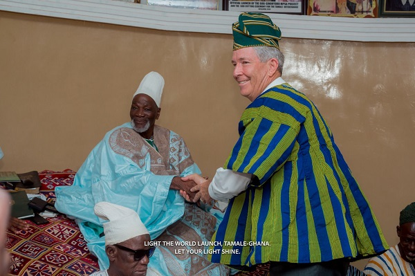 Elder S. Gifford Nielsen shakes hands with Yaa Naa Abubakari Mahama II