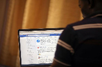 A man opens the Facebook page on his computer to fact check coronavirus disease, PHOTO | REUTERS