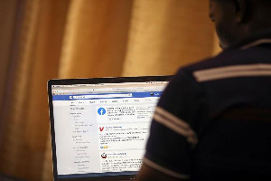 A man opens the Facebook page on his computer to fact check coronavirus disease, PHOTO | REUTERS