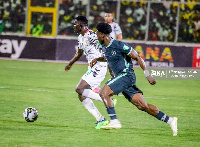 Black Stars striker, Felix Afena Gyan beats Ola Aina to the ball