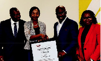 Odunfa, CEO, Digital Jewels presenting the ISO 27001 certificate to Frank Adu Jnr., MD of CalBank