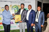 Olam officials receive the award at the ceremony