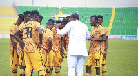 Legon Cities manager, Maxwell Konadu having pep talk with his players