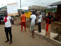 Some members of the concerned citizens of Tarkwa-Nsuaem with their placard's