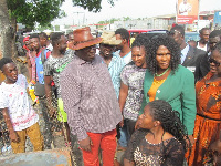 Ablekuma MP, Akua Afiriyie and NADMO Coordinator Cobbina Archibald  withthe fire victims