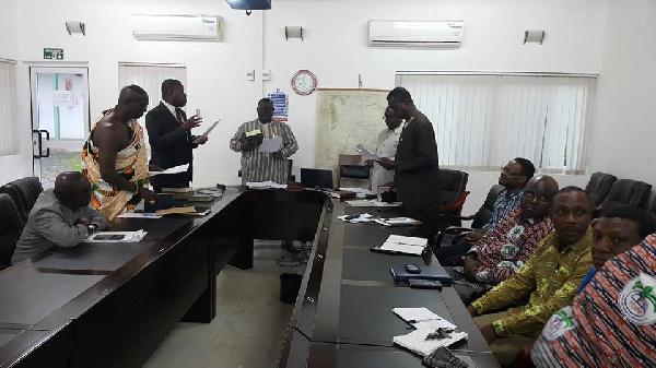 Agriculture Minister (middle) swearing in Board Members