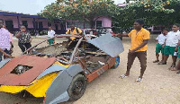 18-year-old JHS graduate, Kelvin Odartey with his manufactured car