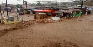 Objects including vehicles were seen being washed away