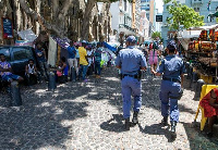 Souvenir businesses near the Methodist church in Cape Town want the group removed citing obstruction