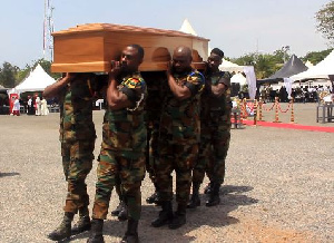 Military personnel carrying the mortal remains of K.B Asante