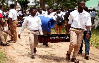 A photo of students returning to school