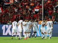 Egyptian players celebrating their victory over Uganda