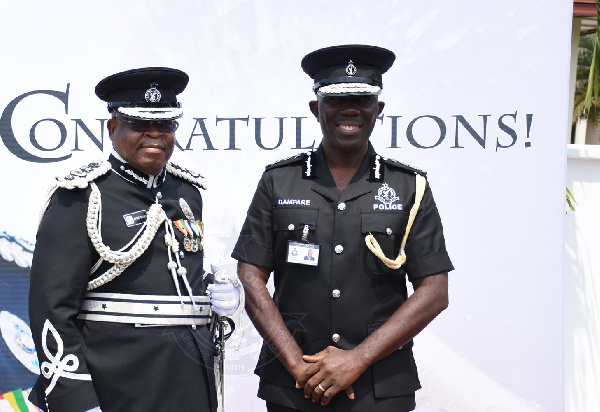 Acting IGP COP Dampare (right) with his immediate predecessor James Oppong-Boanuh