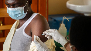 A photo of a person taking the coronavirus vaccine