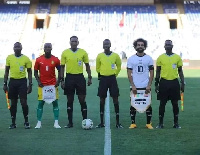 The match officials with skippers of both sides