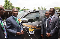 Professor Obiri Danso, receiving the key, Mr. Samuel Sarpong, Chief Operating Officer of GCB