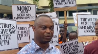 Some citizens wielding placards with various inscriptions