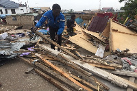 Some traders scavenging from the ruins