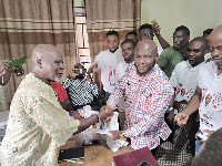 Benjamin Nargeh (right) submits his form to Stephen Onumah (left)