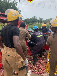 Officials of the Ghana National Fire Service rescuing the accident victims