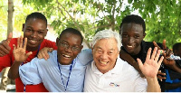 Rev Ock Soo Park in the midst of some youth of IYF