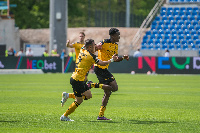 Akoto (right) is joined by a teammate to celebrate his goal