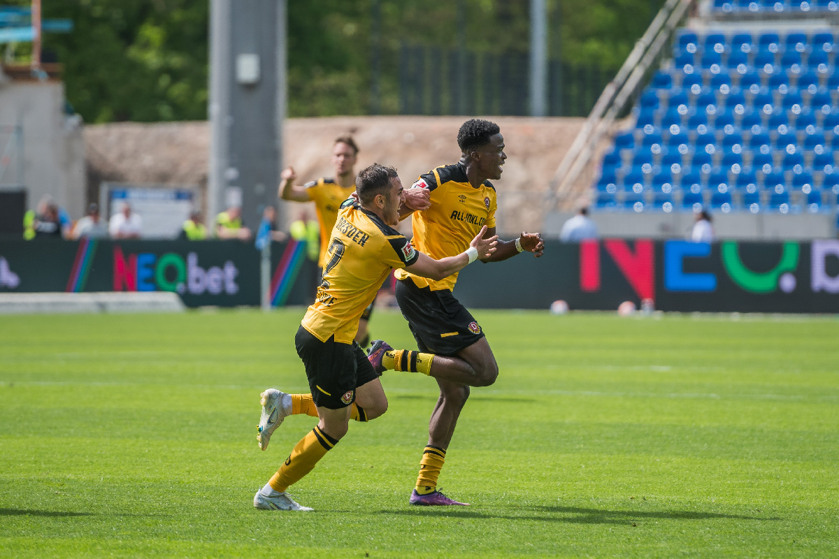 Akoto (right) is joined by a teammate to celebrate his goal