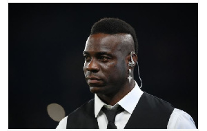 Former Italy forward Mario Balotelli watches the celebrations after the UEFA Champions League final