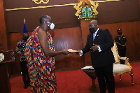 President Akufo-Addo receives the report from chair of the Council of State