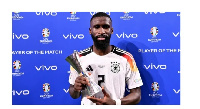 Real Madrid’s Antonio Rudiger poses with his MoM trophy after Germany’s win over Denmark