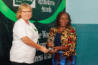 Mrs. Bettina Schoop Component Manager - AgriBiz presenting an award to a winner