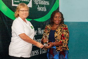 Mrs. Bettina Schoop Component Manager - AgriBiz presenting an award to a winner