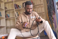 Jeffrey Kwabena Yeboah  working on some of his furniture